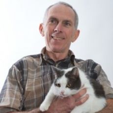 Dr. Jim Raddatz holding a cat